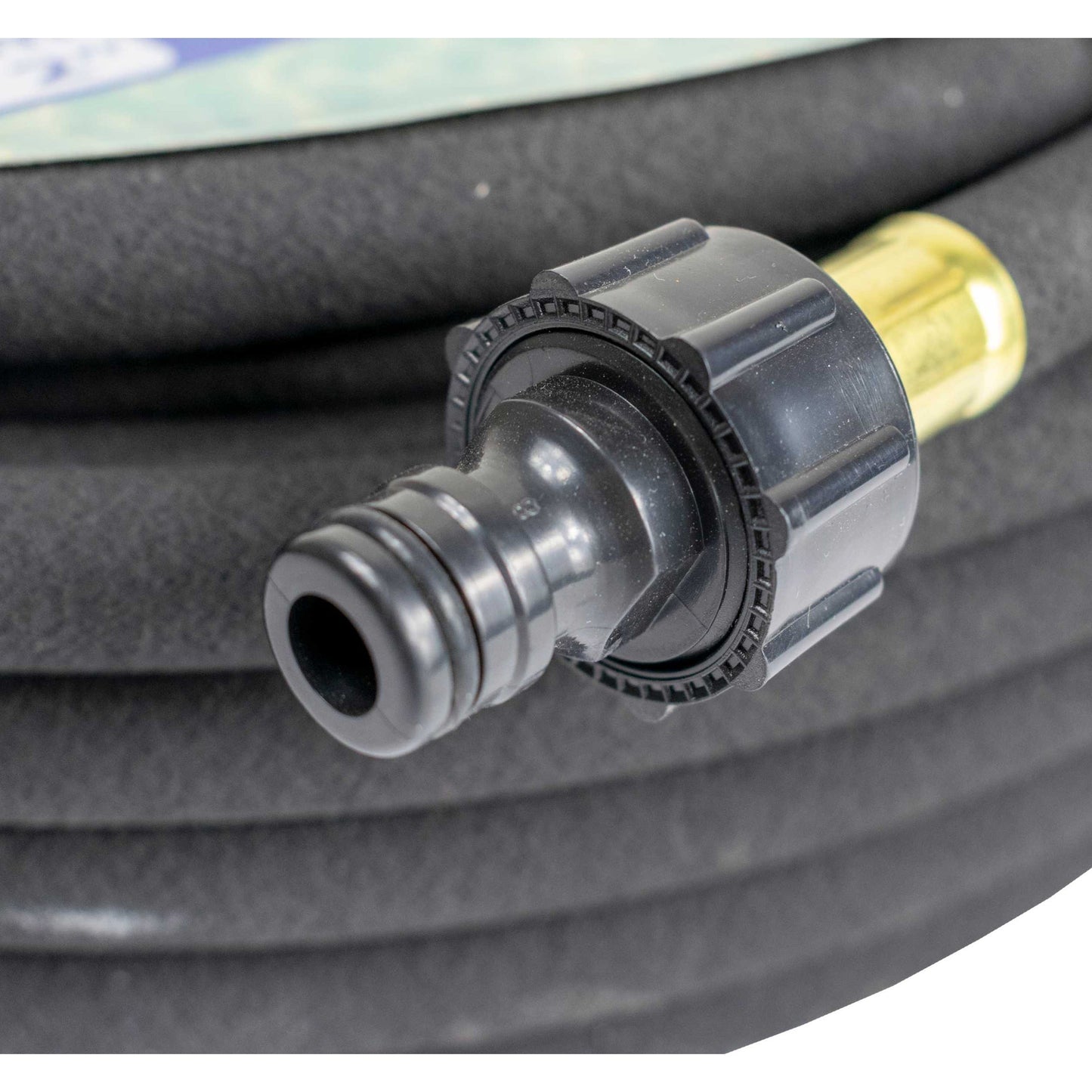 Connector end of the porous soaker hose with black coupling and gold insert
