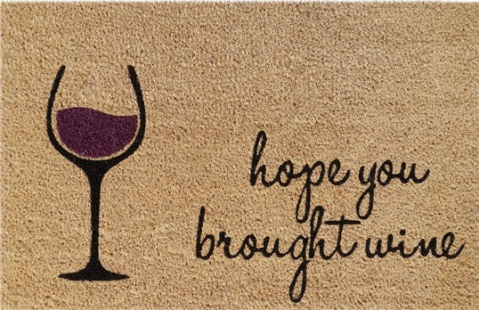 Doormat with wine glass and handwritten style 'hope you brought wine'