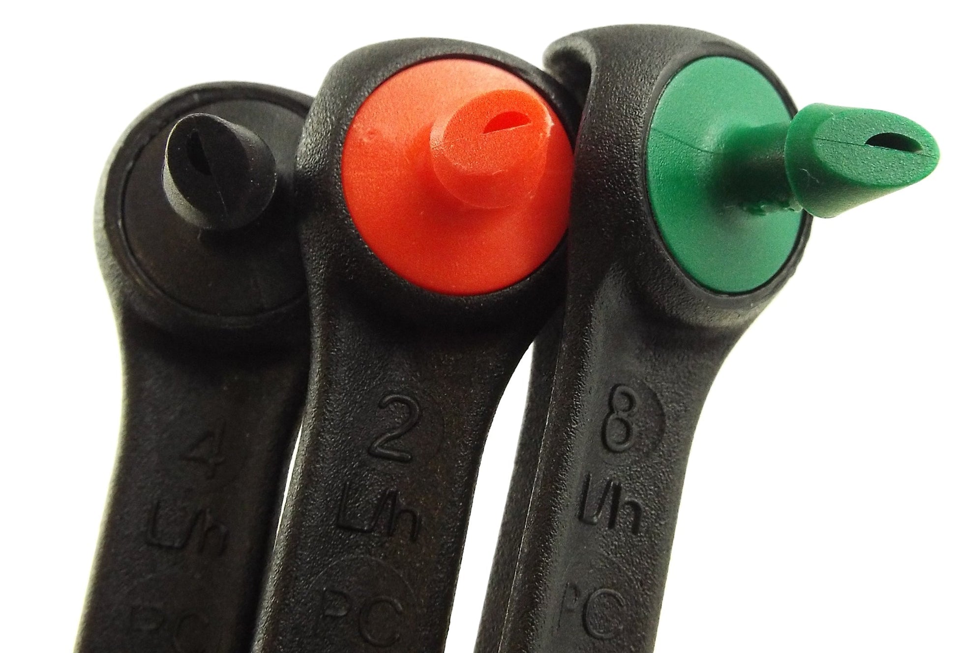 Pair of drippers side by side: black bodies with red and green outlet inserts
