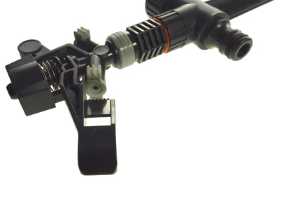 Bottom close-up of black spike sprinkler with hose connection and spring clamp