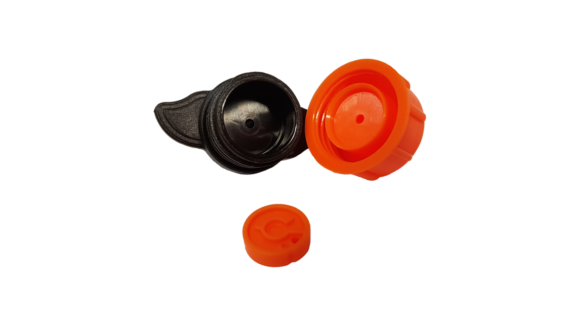 Turbo Dripper parts: orange cap, black insert, and small orange sealing cap