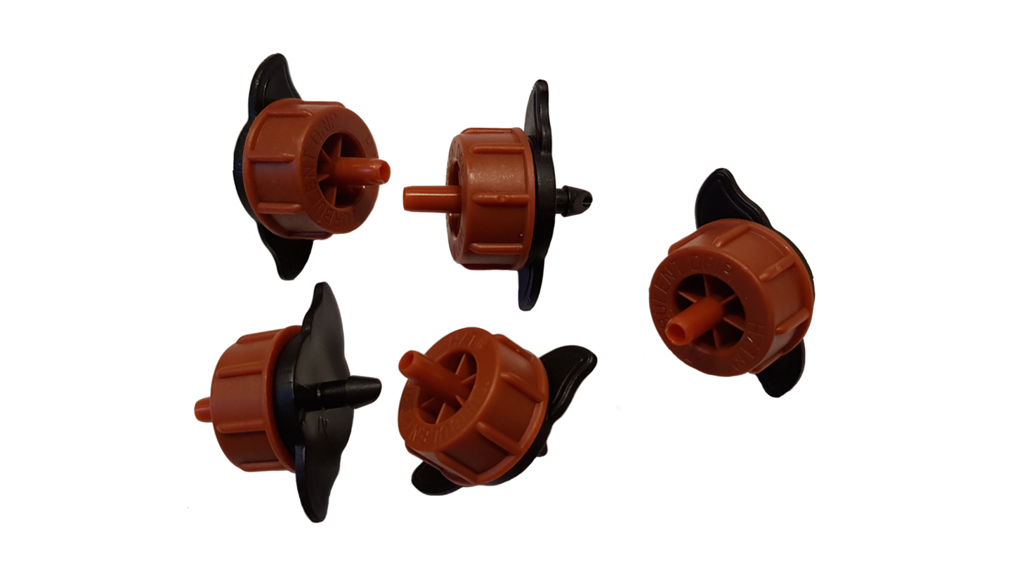 Assorted orange non-pressure drippers with black stakes, side view