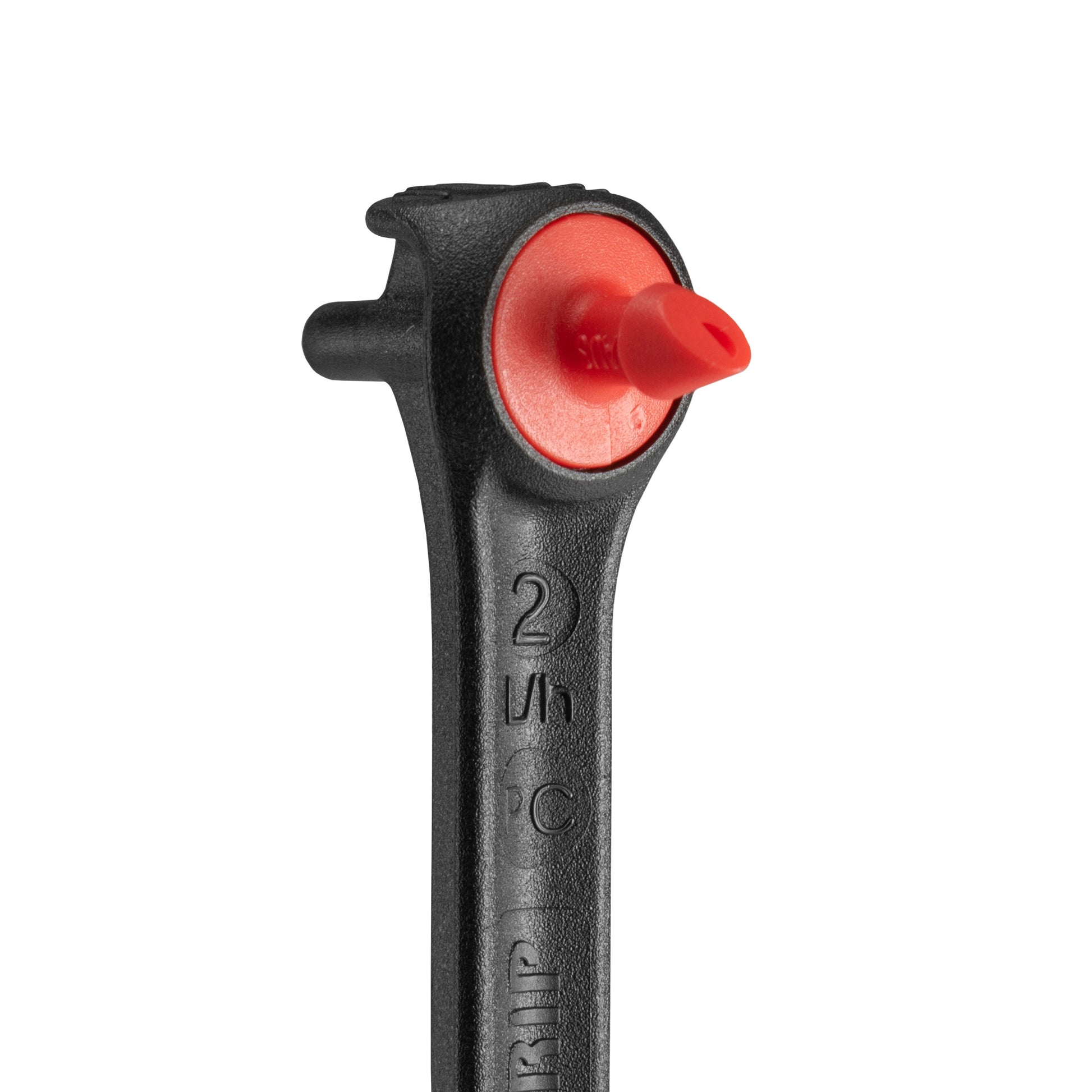 Close-up of spike dripper outlet with red pressure-compensating insert