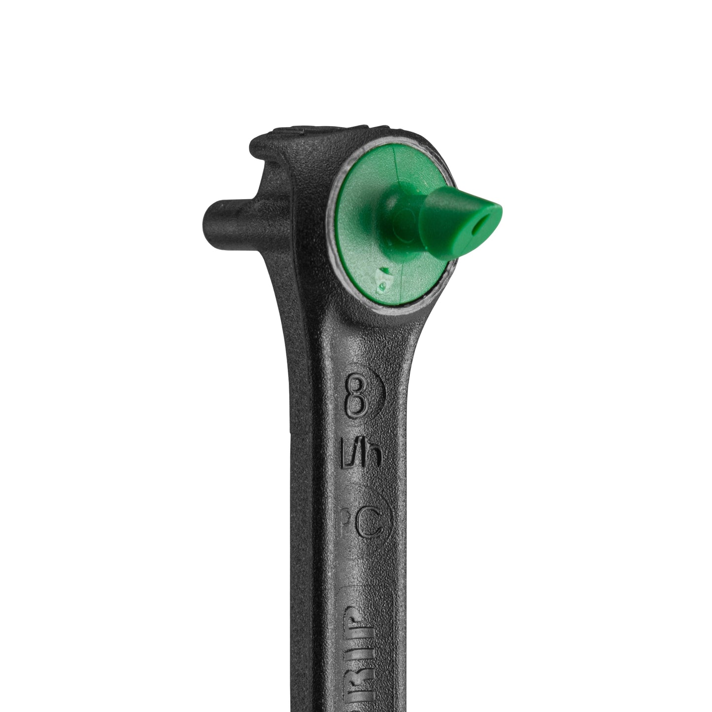 Close-up of black drip spike dripper head with green insert outlet
