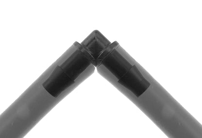 Black 90° micro elbow connector with 4.5mm barbs, close-up of tube ends