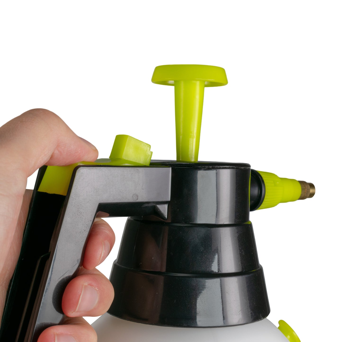 Hand holding the black pump handle of the lime-green nozzle sprayer