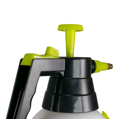 Detailed view of black pump head, lime cap and trigger handle, spray nozzle