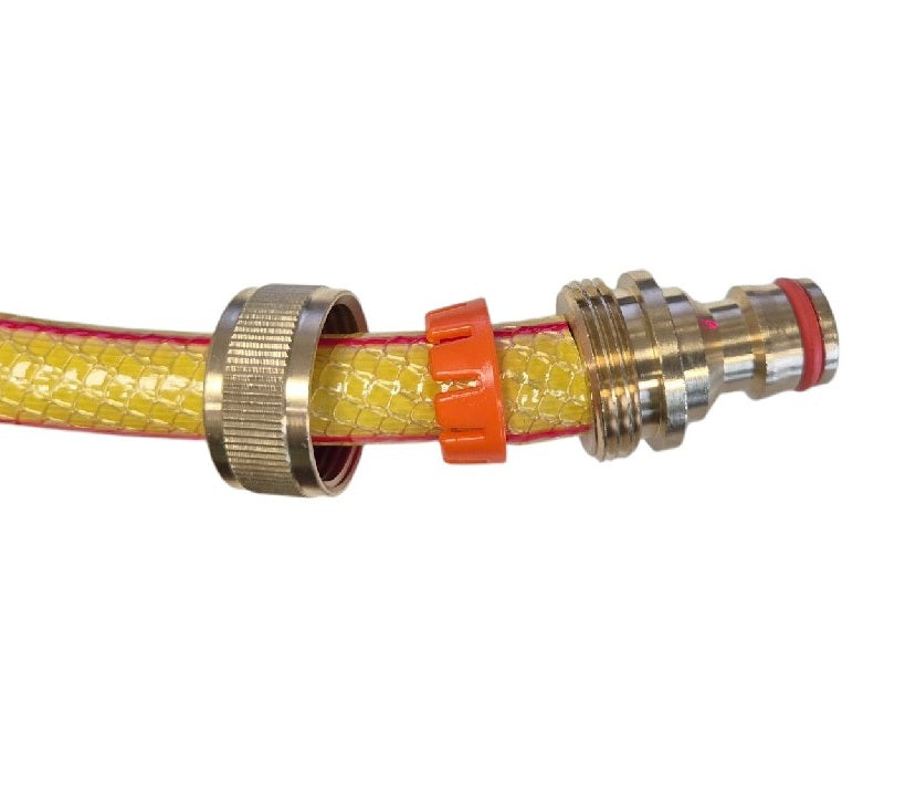 Hose connection view: yellow textured hose with orange clip and metal quick fitting