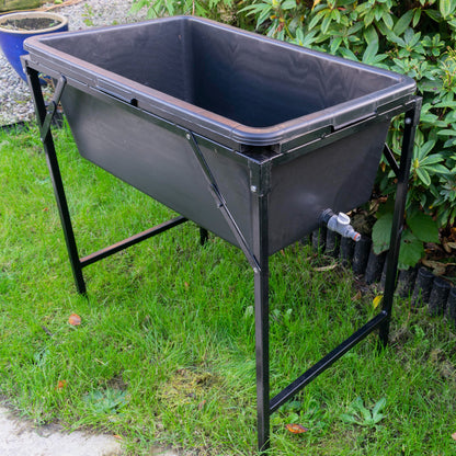 Dog bath tub with tap and stand, large black plastic basin on metal legs