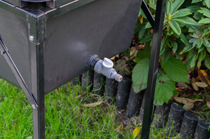 Dog bath tap outlet and hose connection on side of black basin