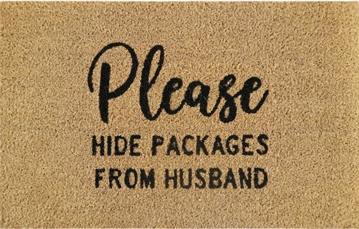 Beige doormat showing „Please Hide Packages From Husband“ lettering