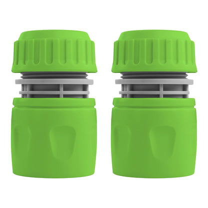 Two green hosepipe connectors with ridged grips and gray inserts