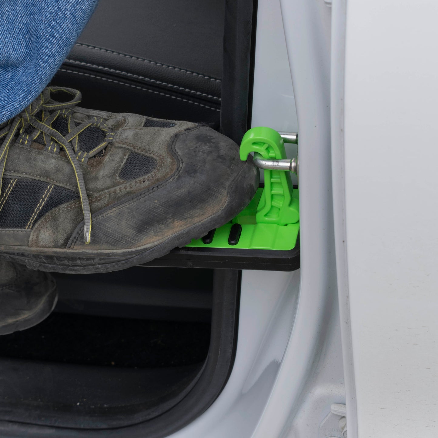 Green Car Door Step Type C with ridged tread surface, used with a shoe