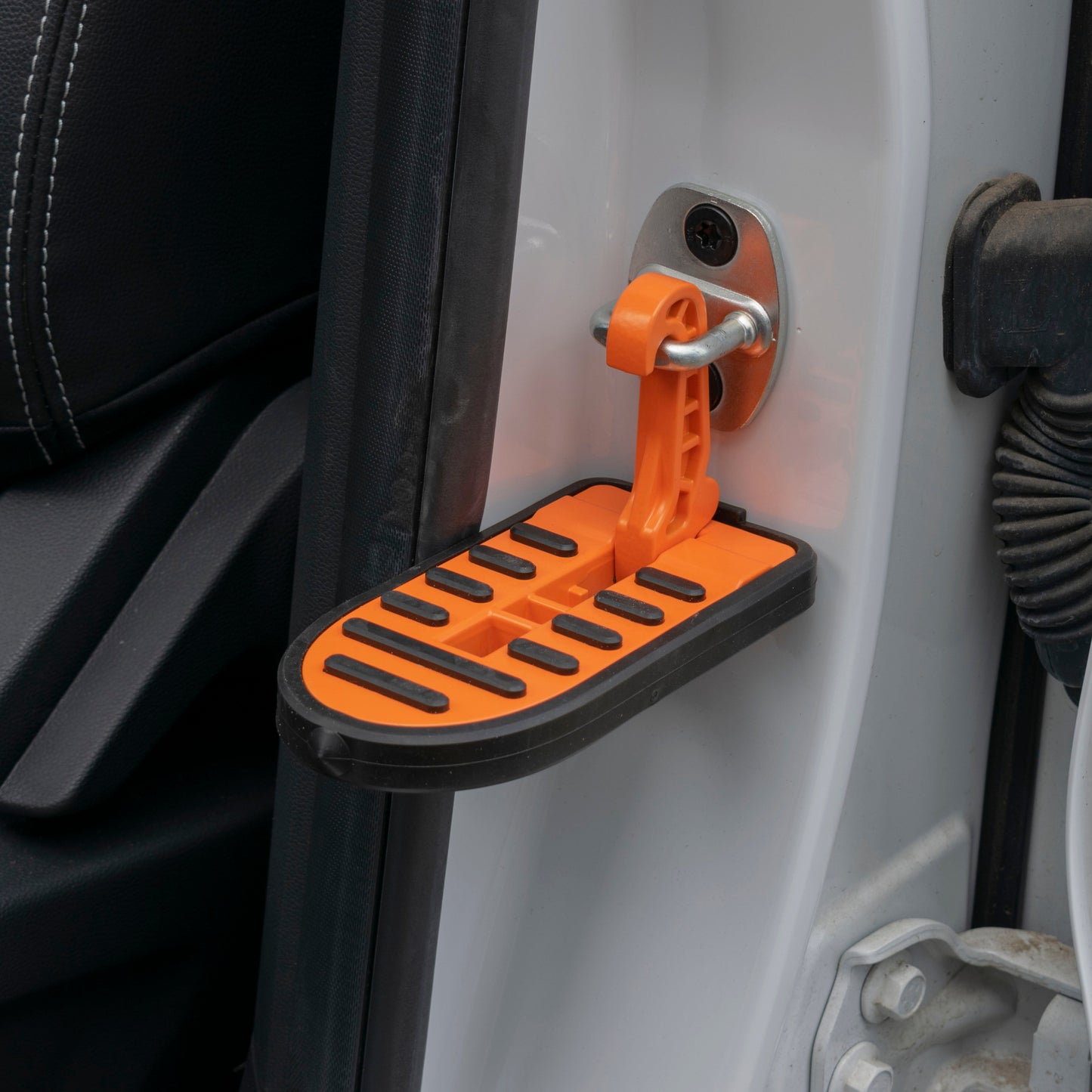 Orange car door step Type C with black grip tread and mounting bracket