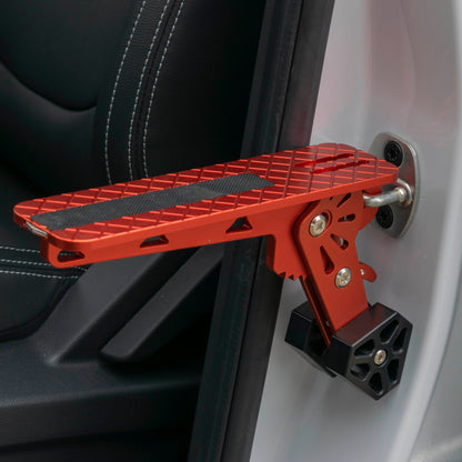 Orange car door step with textured tread, black grip strip, and metal mounting bracket