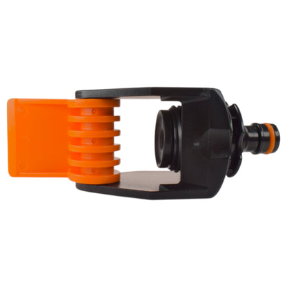 Orange internal ring and black housing on tap adapter connection with outlet port.