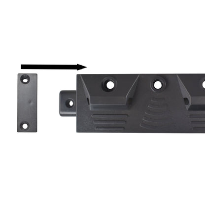 Close-up of black tool rail mounting plate with screw holes