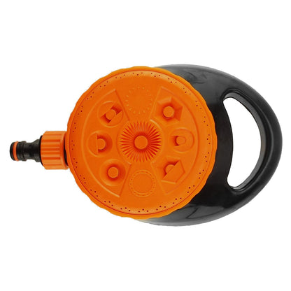 Orange and black static lawn sprinkler head with patterned spray face and handle loop