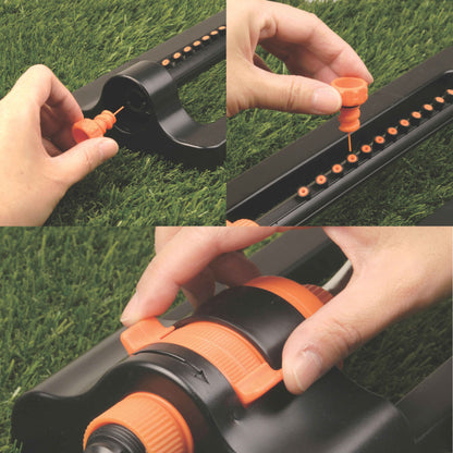 Hands adjusting the orange cap on a compact oscillating sprinkler for fitting the hose