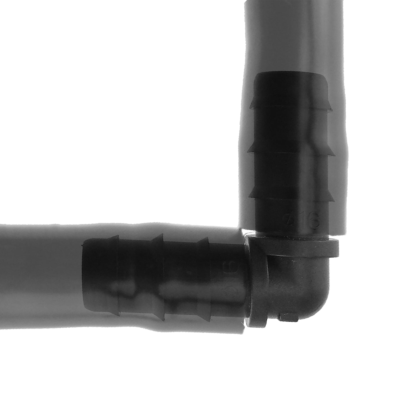 Close-up black barbed elbow connector joining a straight pipe section