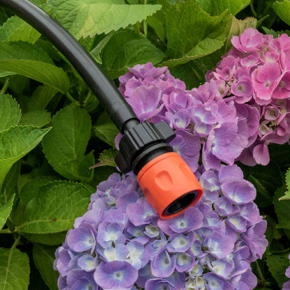 16mm quick-connect barbed valve fitting attached to hose, black and orange ends