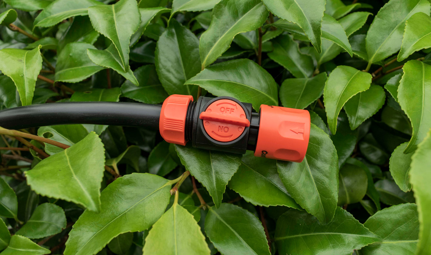 Orange hose connector with built-in valve and ON/OFF dial on black center piece