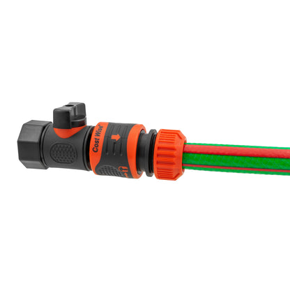 Quick connect valve with hose inserted into orange connector and black outlet body