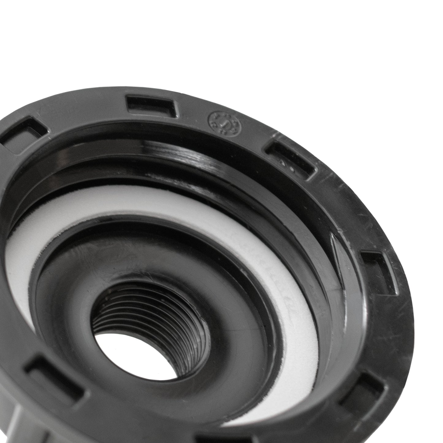 Close-up of IBC cap insert with internal thread and circular opening