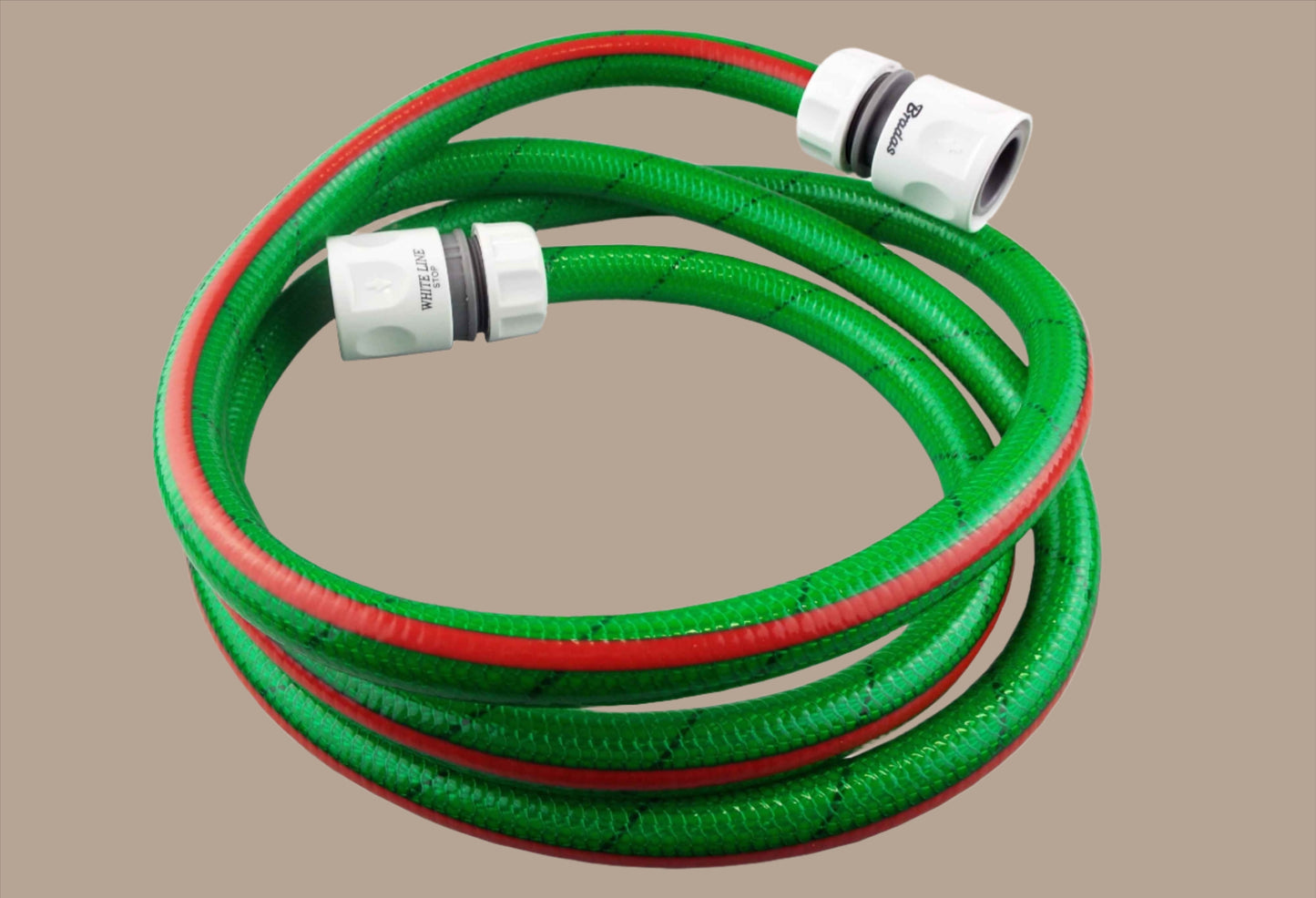 Green garden hose set with white connectors and flexible braided hose