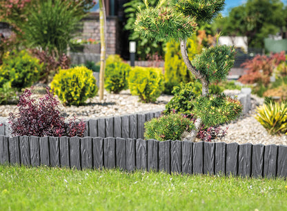 Gray plastic lawn edging border with wood-effect slats and pointed stake ends