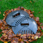 Dark gray leaf scoop with claw-like tines and curved guard for collecting leaves