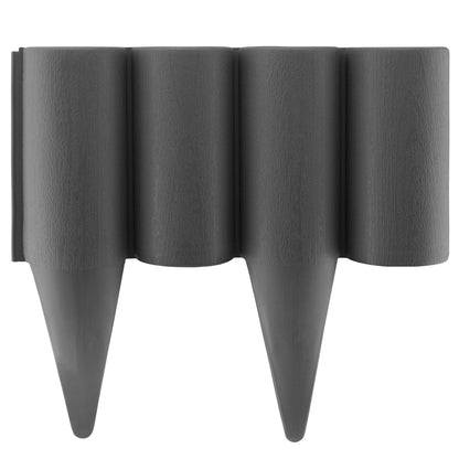 Gray plastic lawn edging palisade with pointed stakes, wood-effect texture