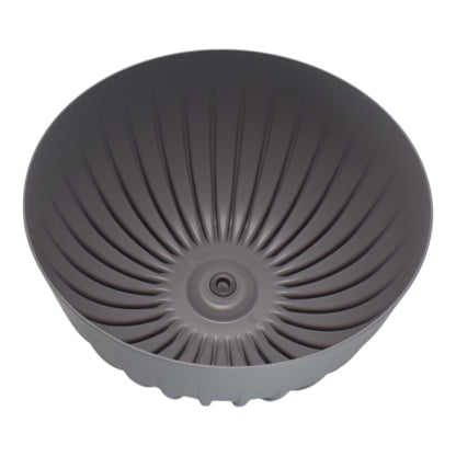 Gray bowl pot underside with central drain opening and fluted channels