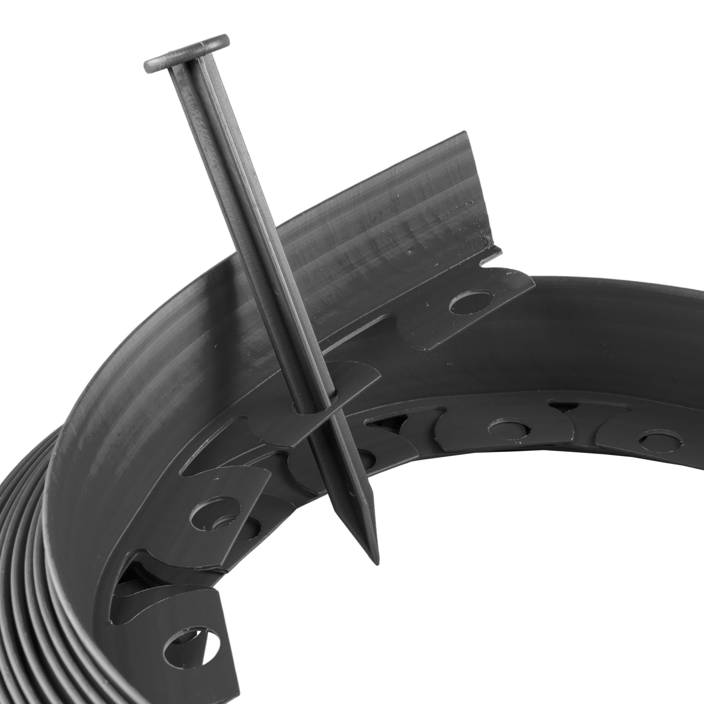 Black ground peg for lawn border edging inserted into the strip