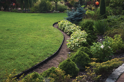 Black lawn border edging strip curved along garden bed edge