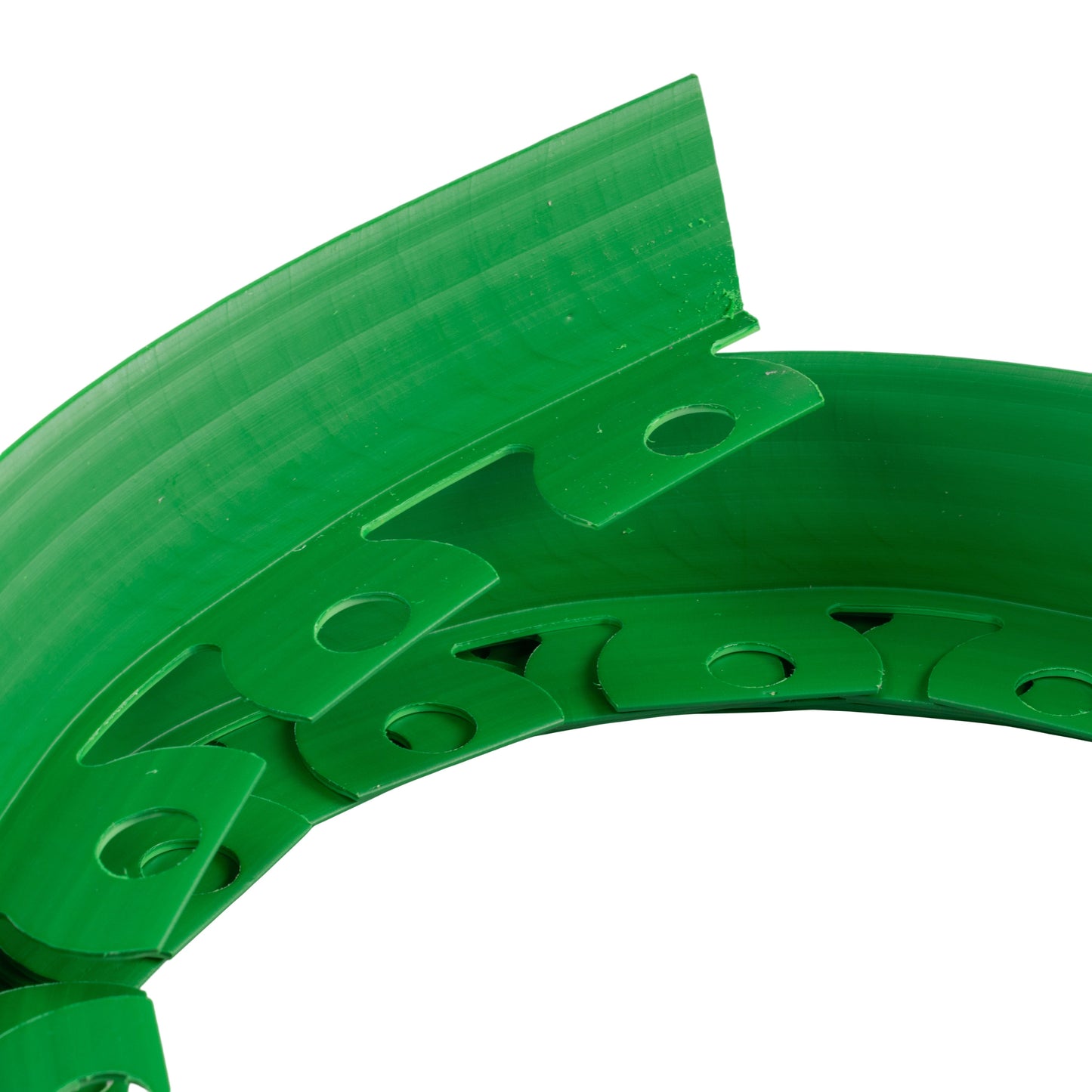 Green lawn edging border segment with fastening holes and curved joining tabs