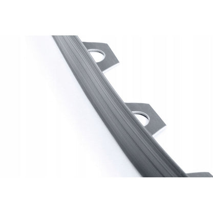 Gray lawn edging strip with evenly spaced fixing holes along the edge
