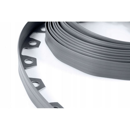 Close-up of gray lawn border strip coil with mounting slots and holes
