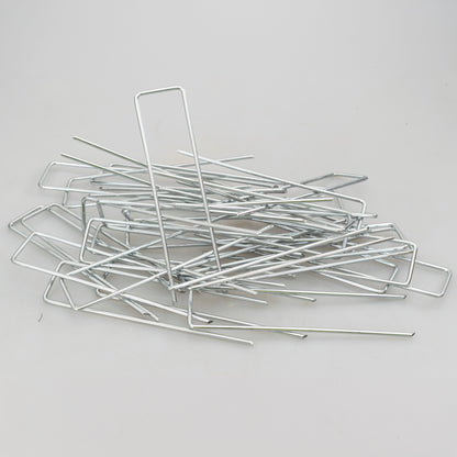 Weed control membrane peg set, galvanized stakes arranged in a heap