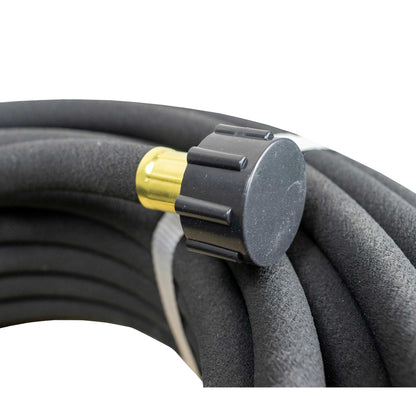 Coiled black porous soaker hose with water-connection fitting at one end