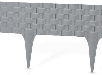 Gray plastic lawn edging with rattan-style pattern and pointed stakes