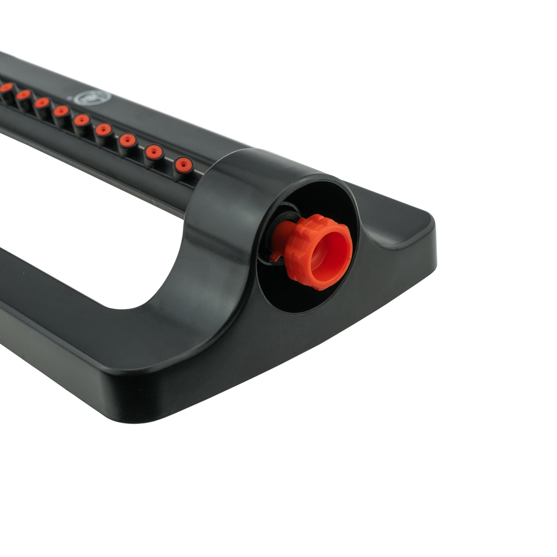 Black sprinkler base end with orange inlet plug in the front opening