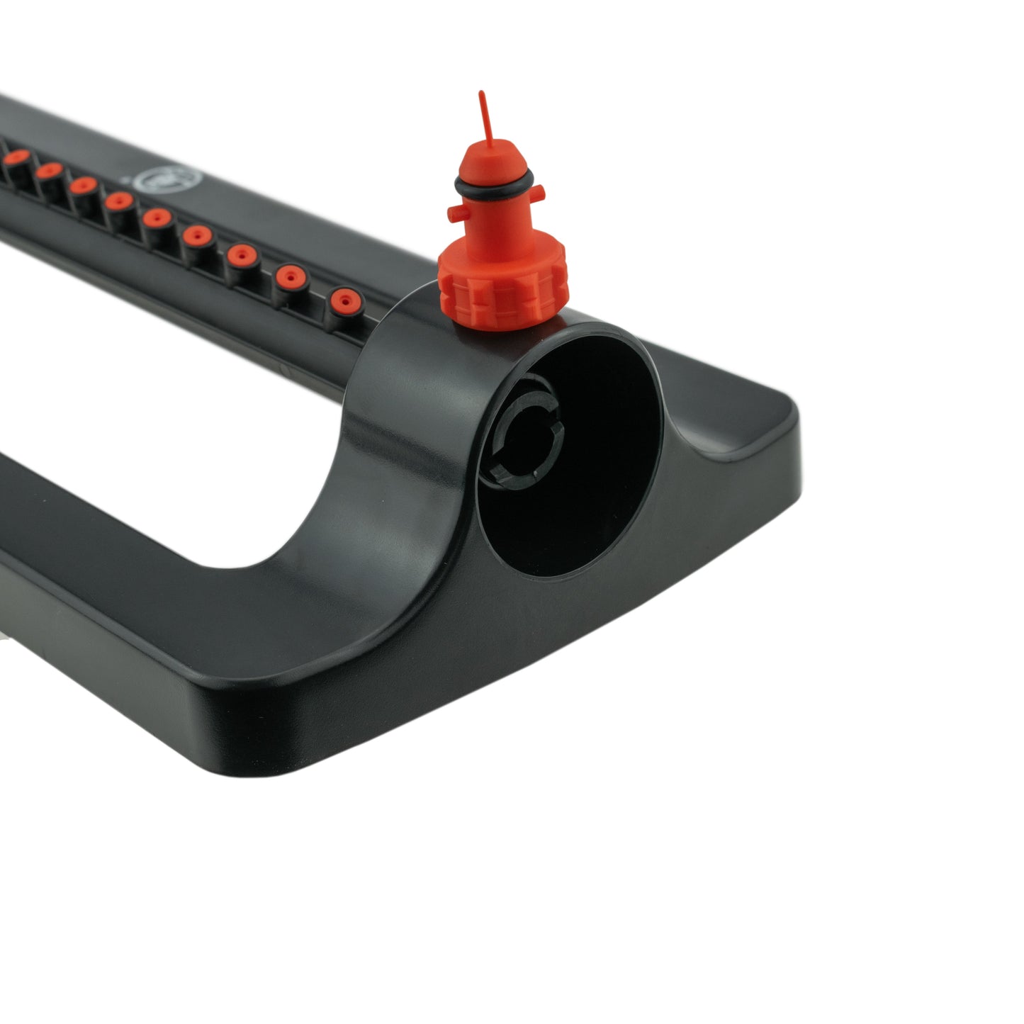 Oscillating sprinkler front with orange inlet cap on black housing
