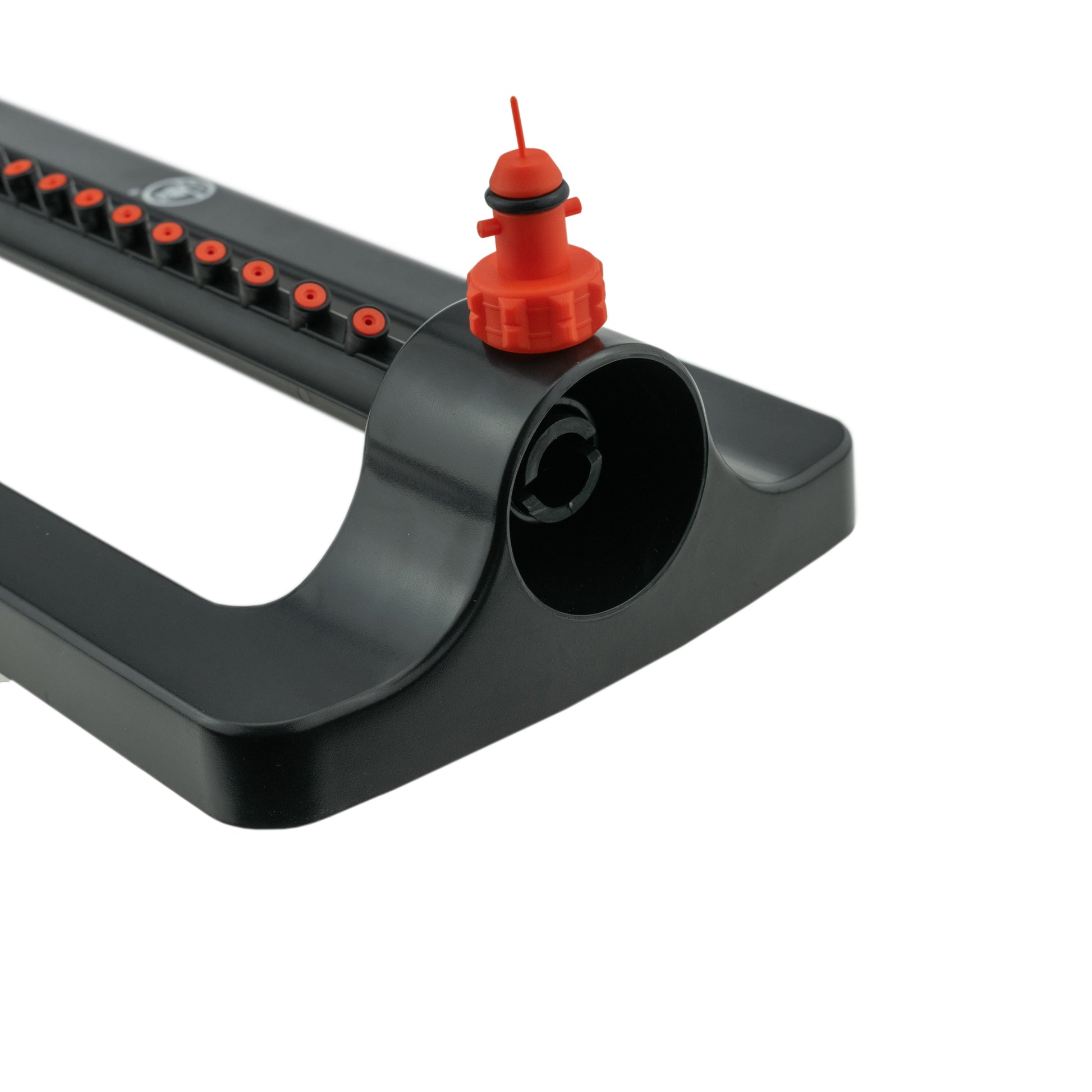 Oscillating sprinkler front with orange inlet cap on black housing