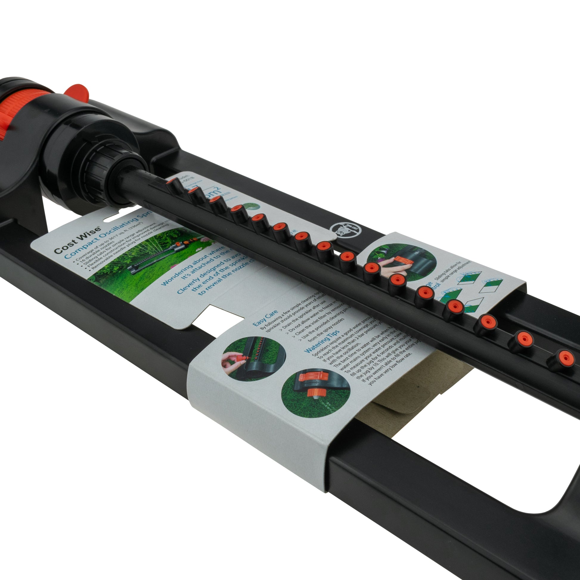 Oscillating sprinkler in black with orange control knob and nozzle row.