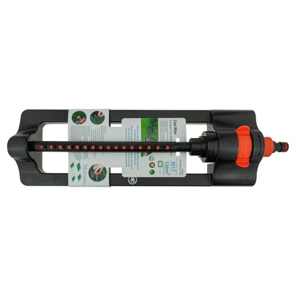 Black oscillating sprinkler with orange dial, front nozzle strip, and instruction labels.