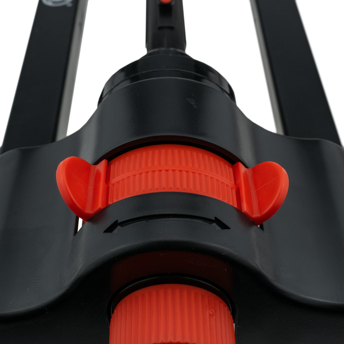 Orange adjustment ring on black sprinkler head with water outlet