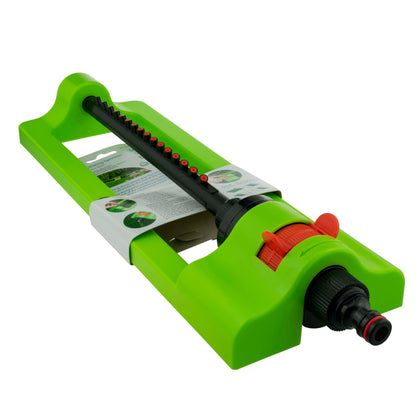 Oscillating sprinkler, green body with orange dial and black hose connector