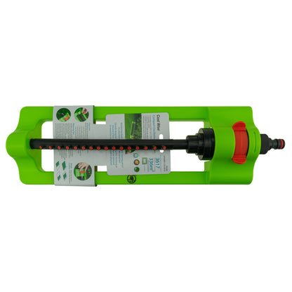 Green oscillating sprinkler with visible label window and black spray bar