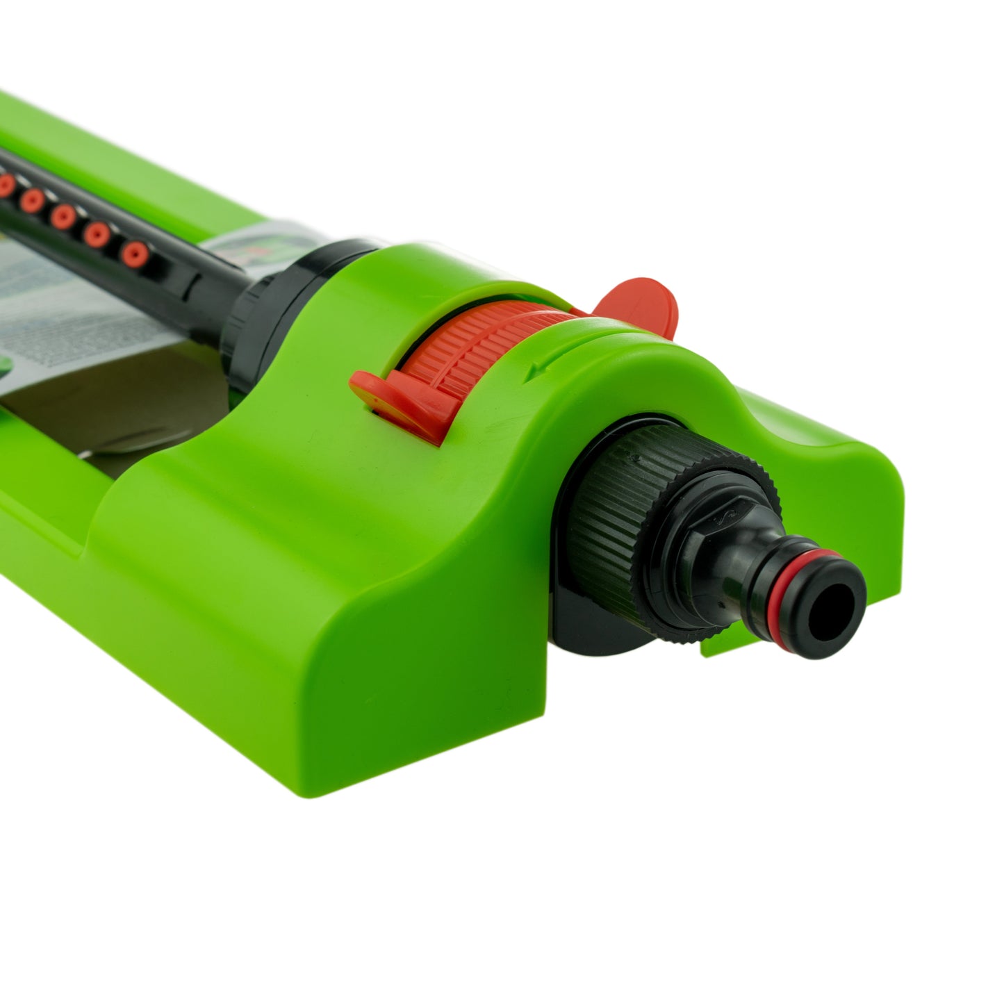 Oscillating sprinkler angled view: green body, orange dial, black water port